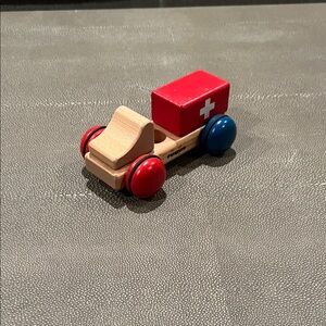 Classic Wooden Toy Ambulance with Red and Blue Wheels